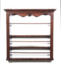 A Hanging Wall Shelf Height 42 inches.