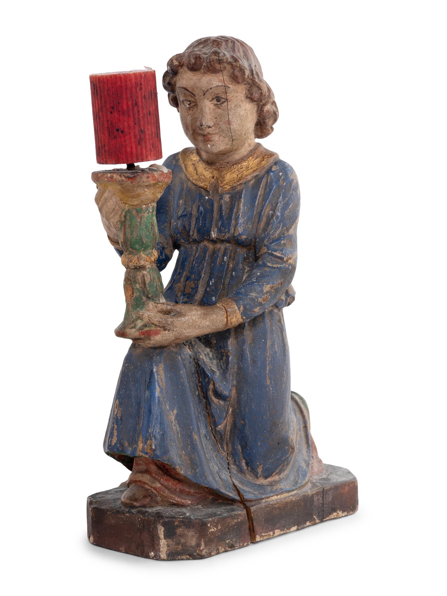 A Pair of Italian Carved and Polychrome Decorated Figural Candlesticks