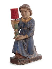 A Pair of Italian Carved and Polychrome Decorated Figural Candlesticks