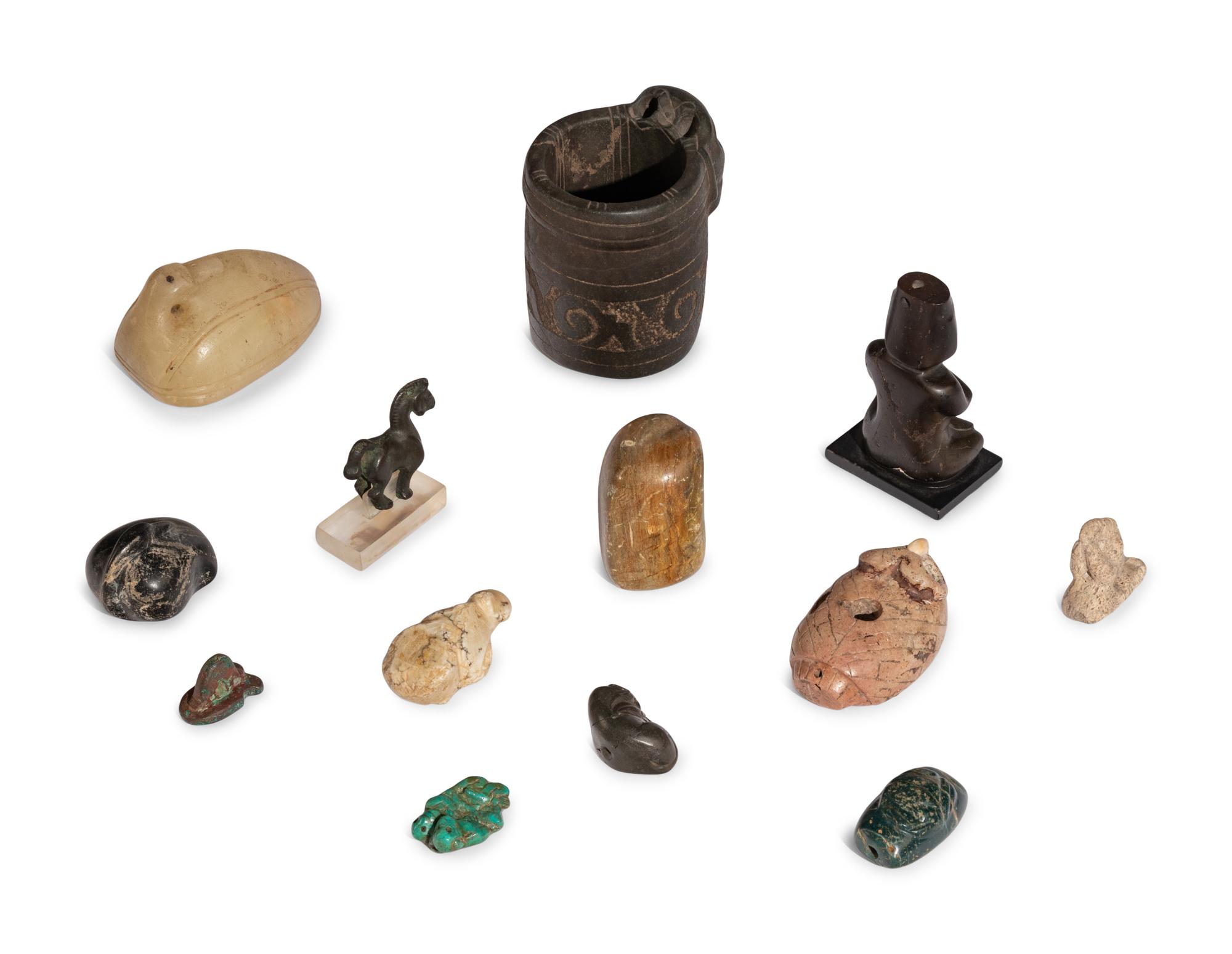A Group of Twelve Pre-Colombian Style and Near Eastern Style Carved Stone Articles
