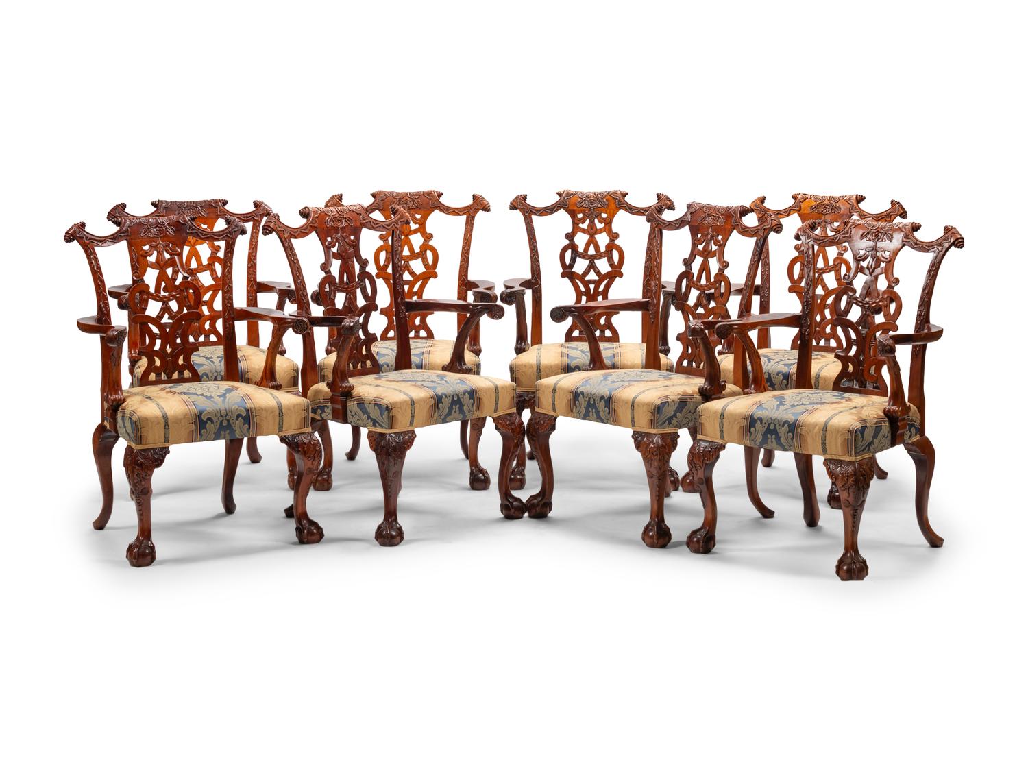 A Set of Sixteen George III Style Carved Walnut Dining Chairs