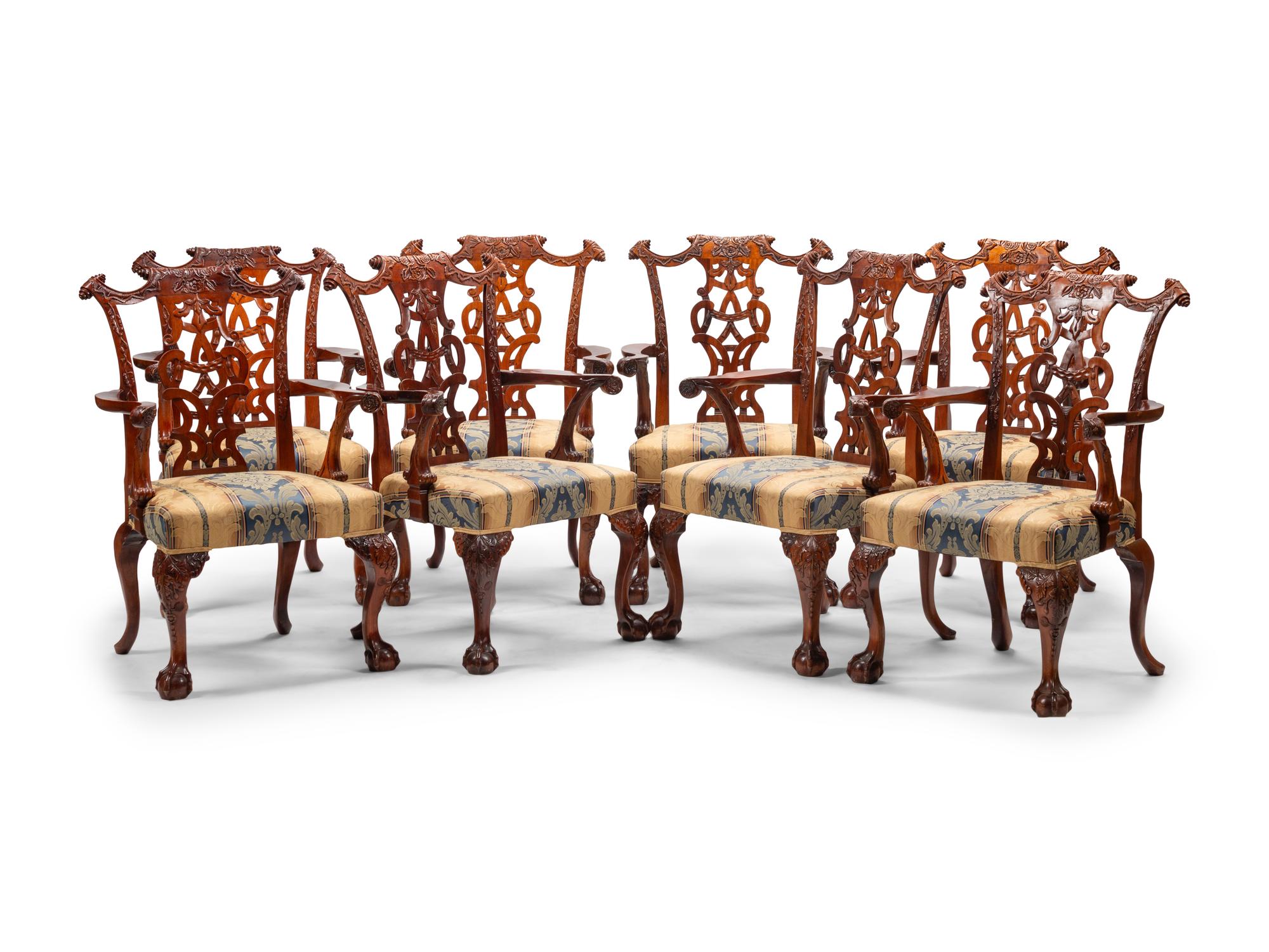 A Set of Sixteen George III Style Carved Walnut Dining Chairs