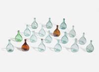 A collection of eighteen mold-blown colored glass calabash bottles, various makers, 19th century