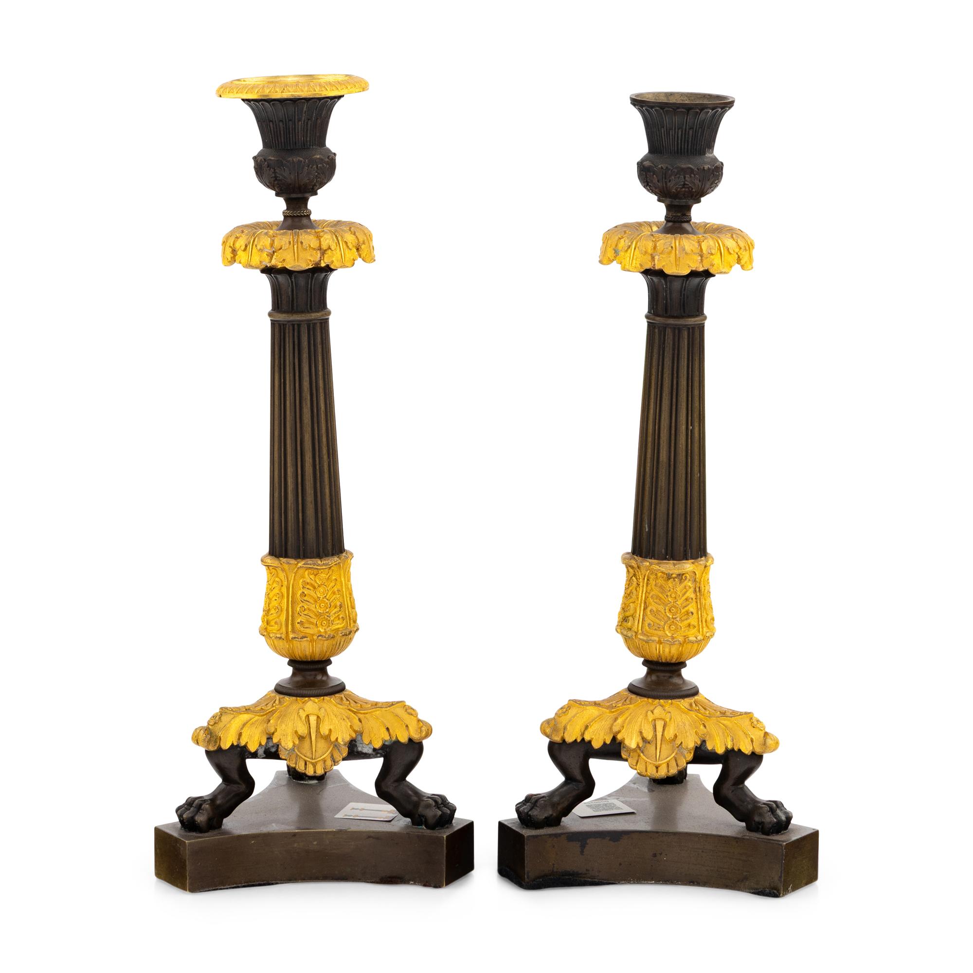 A Pair of Charles X Gilt and Patinated Bronze Candlesticks