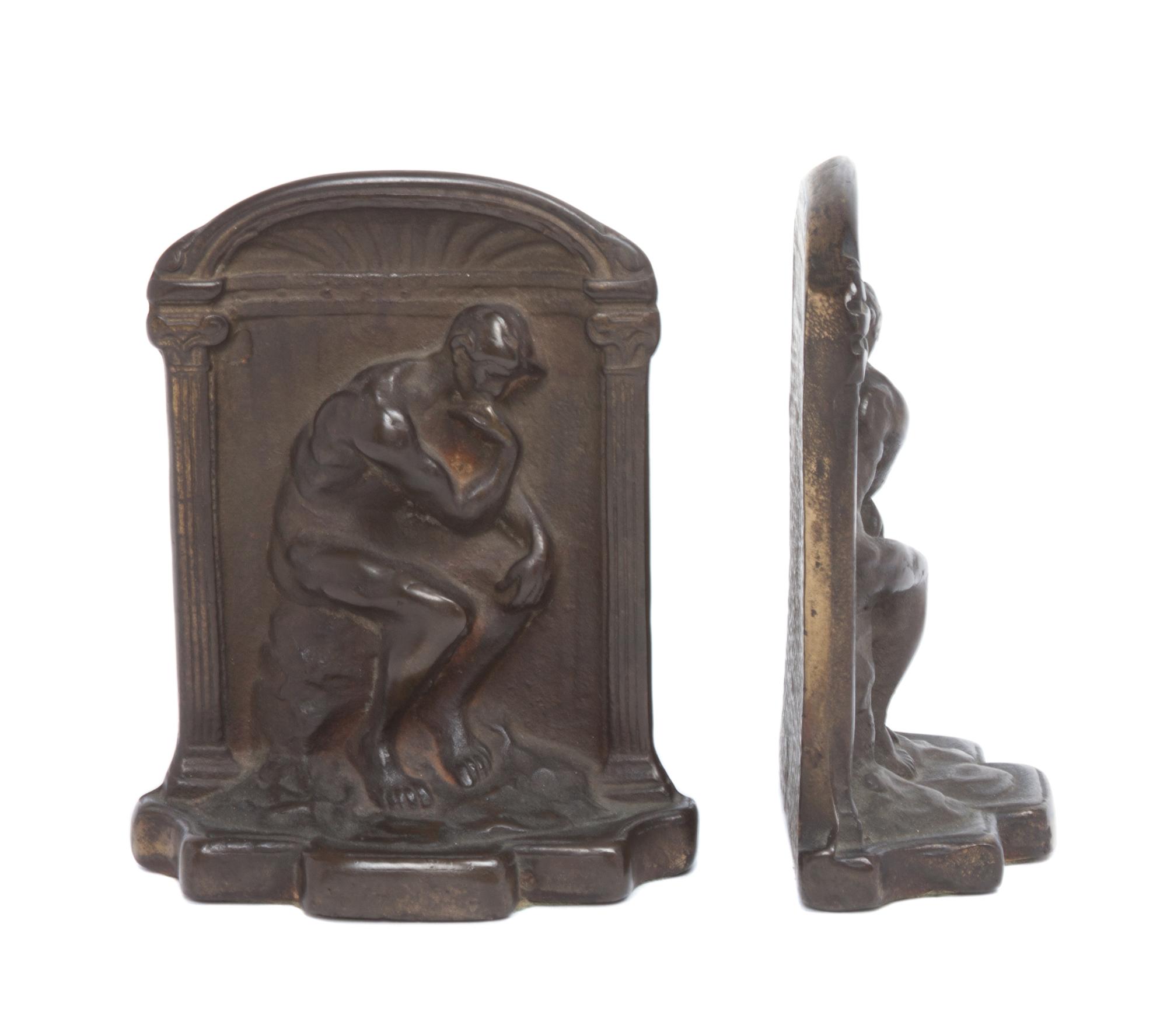 A Pair of Cast Iron Bookends Height 5 1/8 inches. — 20TH CENTURY