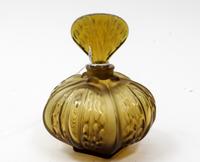 A Lalique Molded and Frosted Glass Perfume Bottle Height 6 1/4 inches.