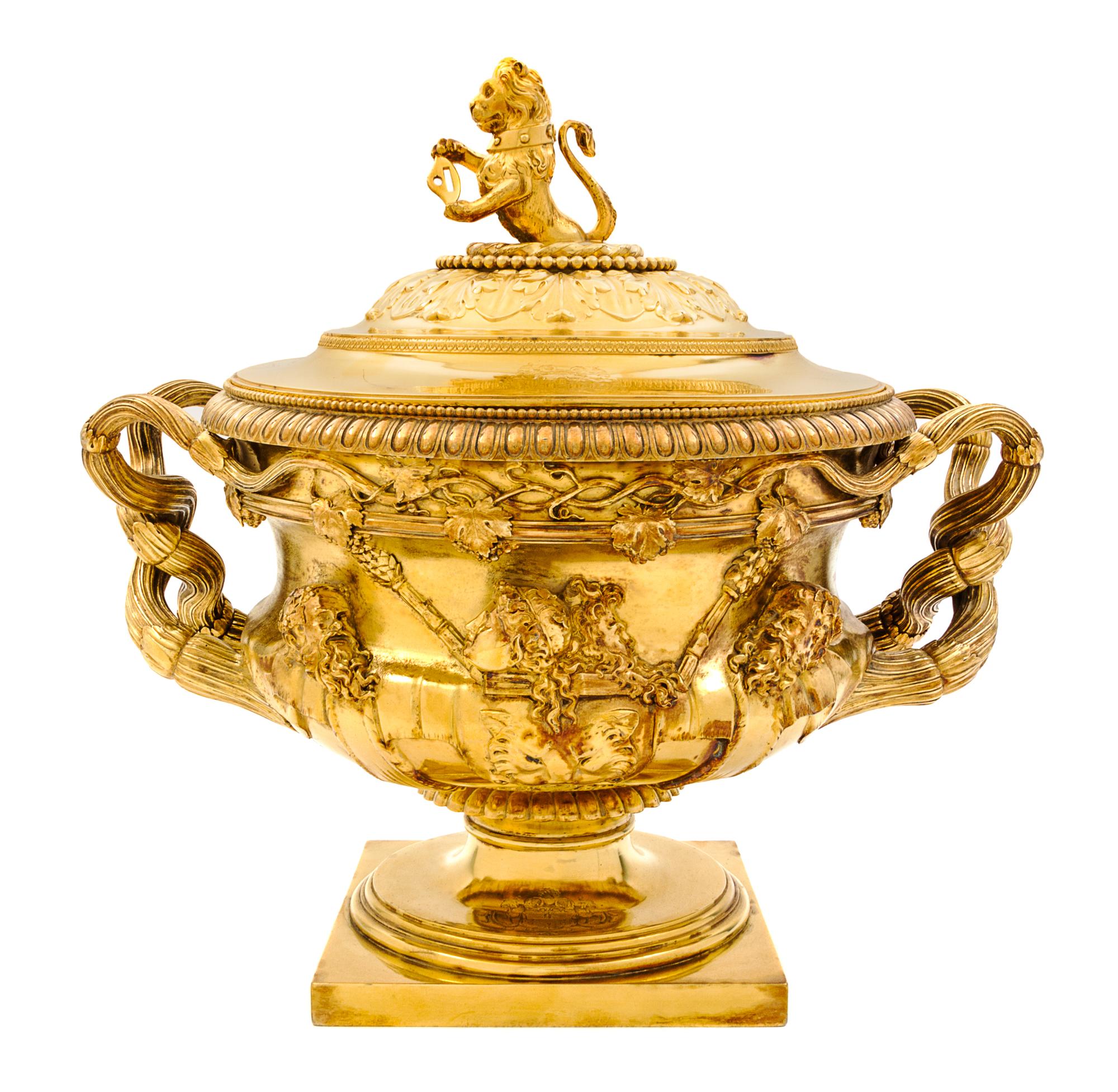 A George III Silver-Gilt Tureen, Benjamin Smith II & Benjamin Smith III, London, 1817, modeled after the Warwick vase, the lid with a l