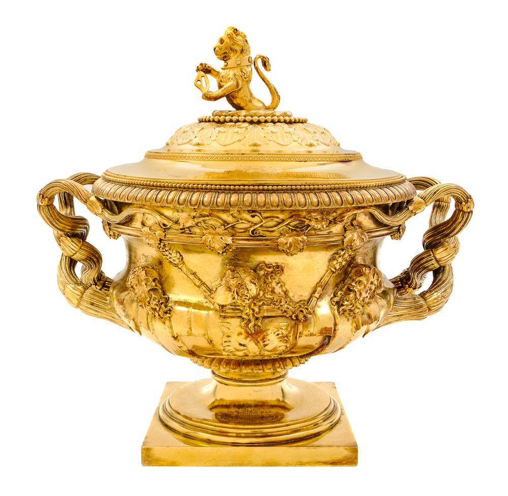 A George III Silver-Gilt Tureen, Benjamin Smith II & Benjamin Smith III, London, 1817, modeled after the Warwick vase, the lid with a l