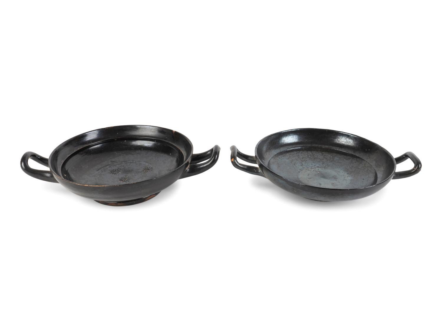 Two Greek Black-Glazed Stemless Kylikes