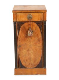 A Northern Italian Walnut and Ebonized Bedside Cabinet