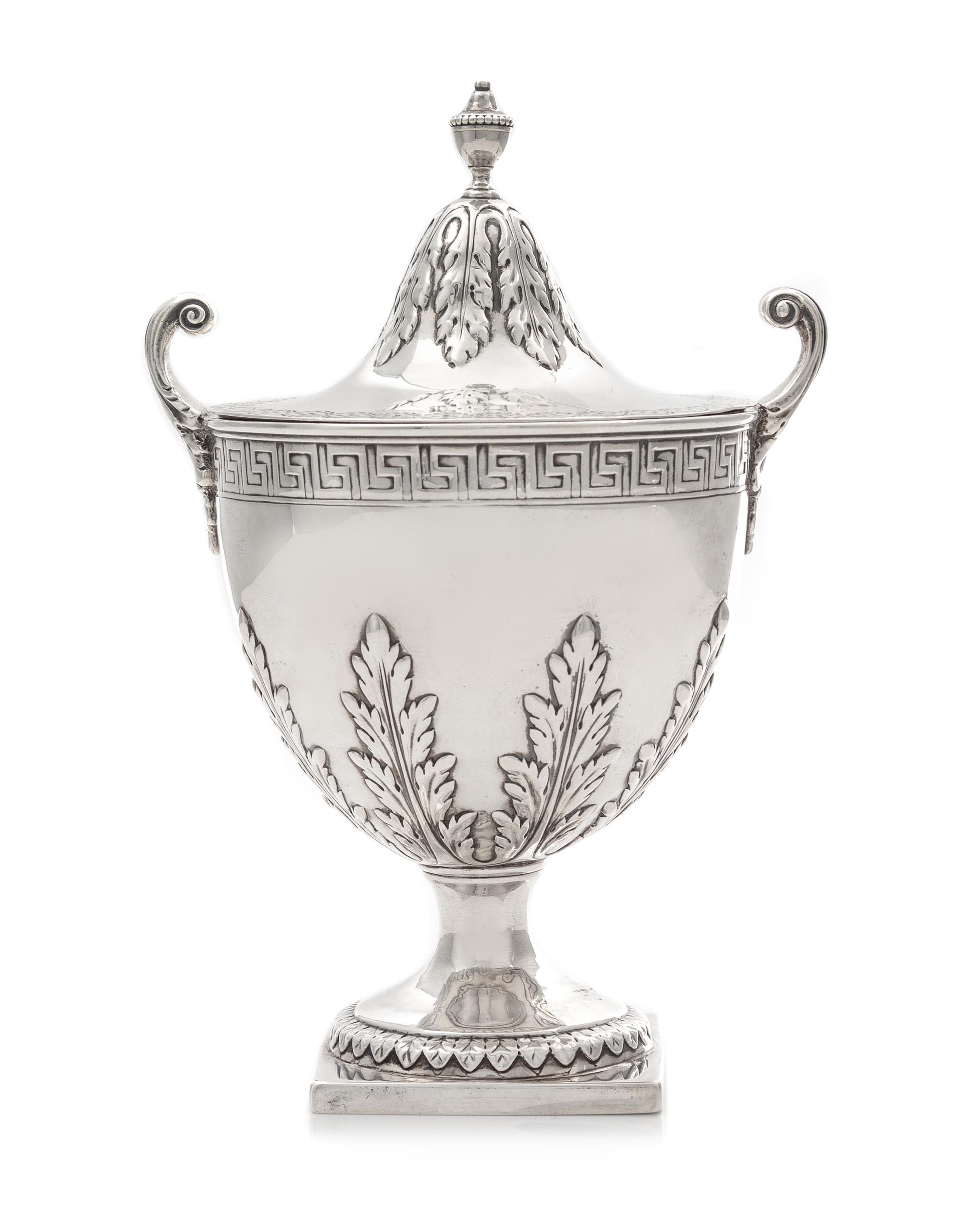 A George III Covered Sugar, Elizabeth Roker, London, 1775, the beaded urn form finial above the acanthus decorated lid, the body with b