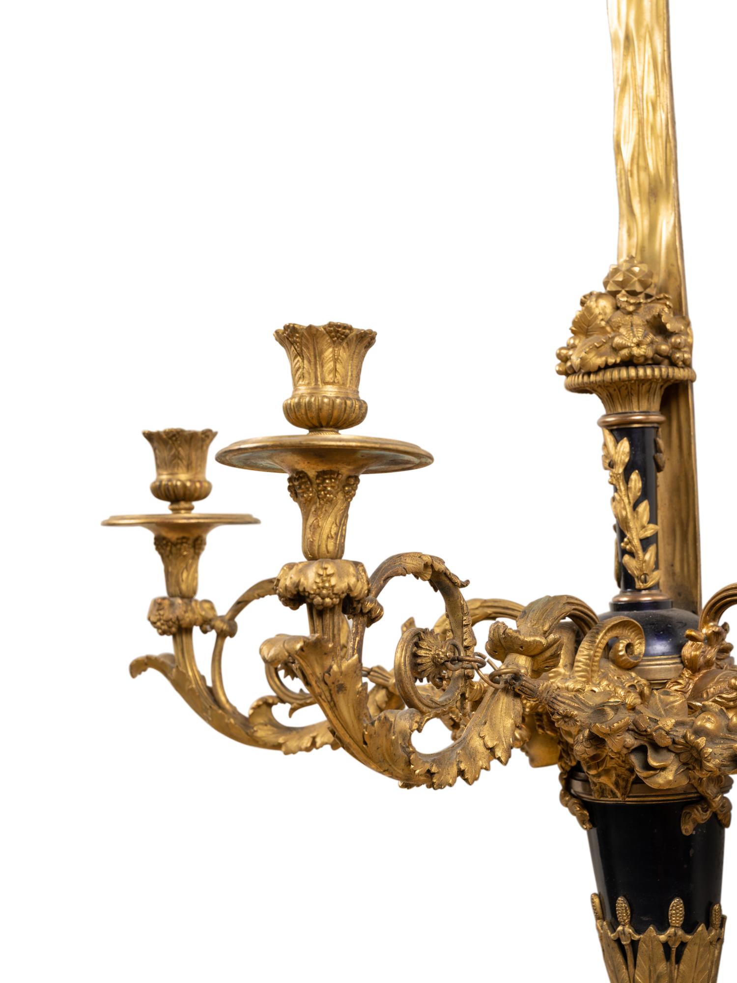A Pair of Louis XVI Style Gilt Bronze Three-Light Wall Sconces