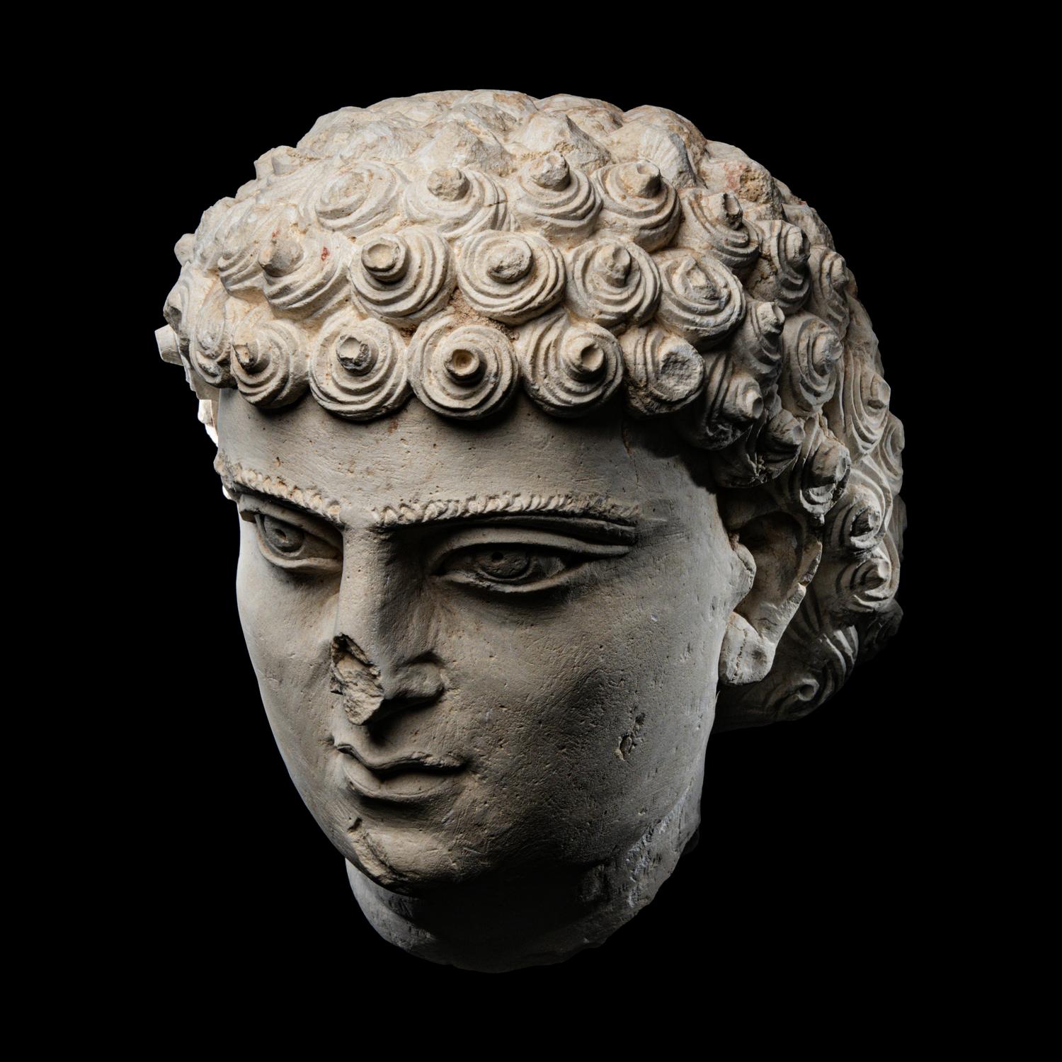 A Palmyrene Limestone Head of a Youth