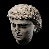 A Palmyrene Limestone Head of a Youth