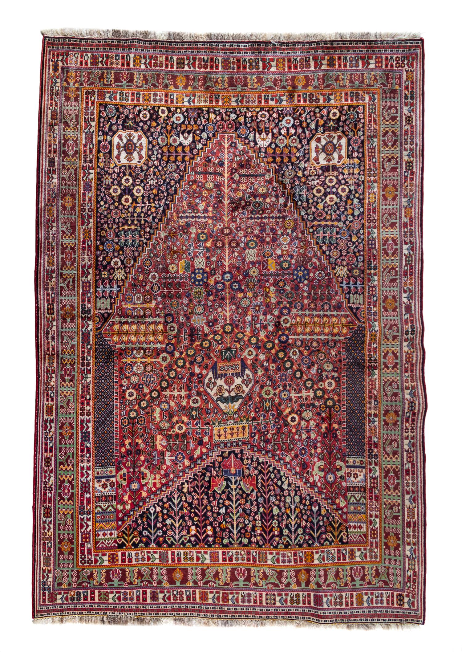 A Shiraz Qashqai Prayer Rug 9 feet 5 1/2 inches x 6 feet 5 1/4 inches.