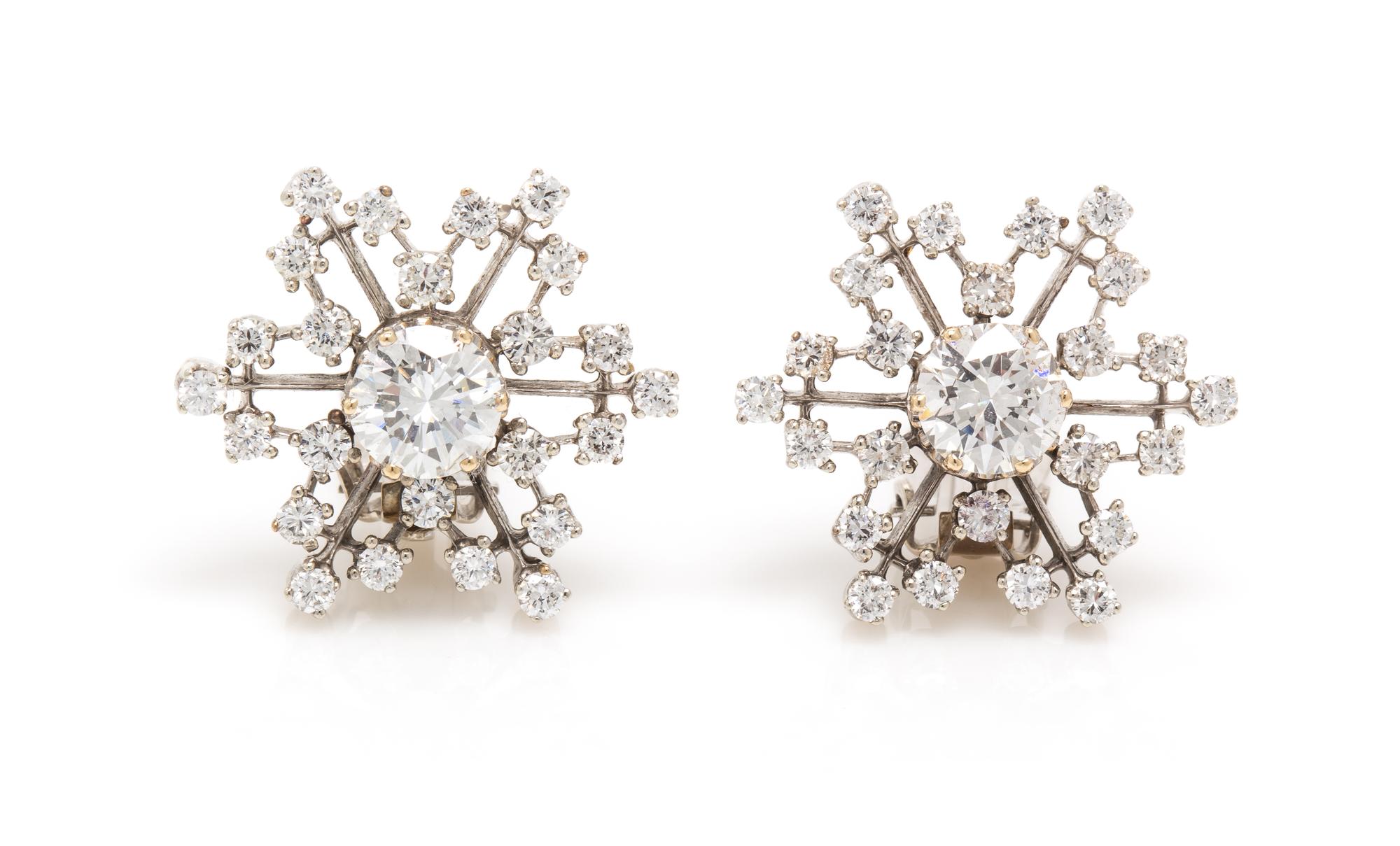 A Pair of 14 Karat White Gold Diamond Cluster Earclips, 4.80 dwts.