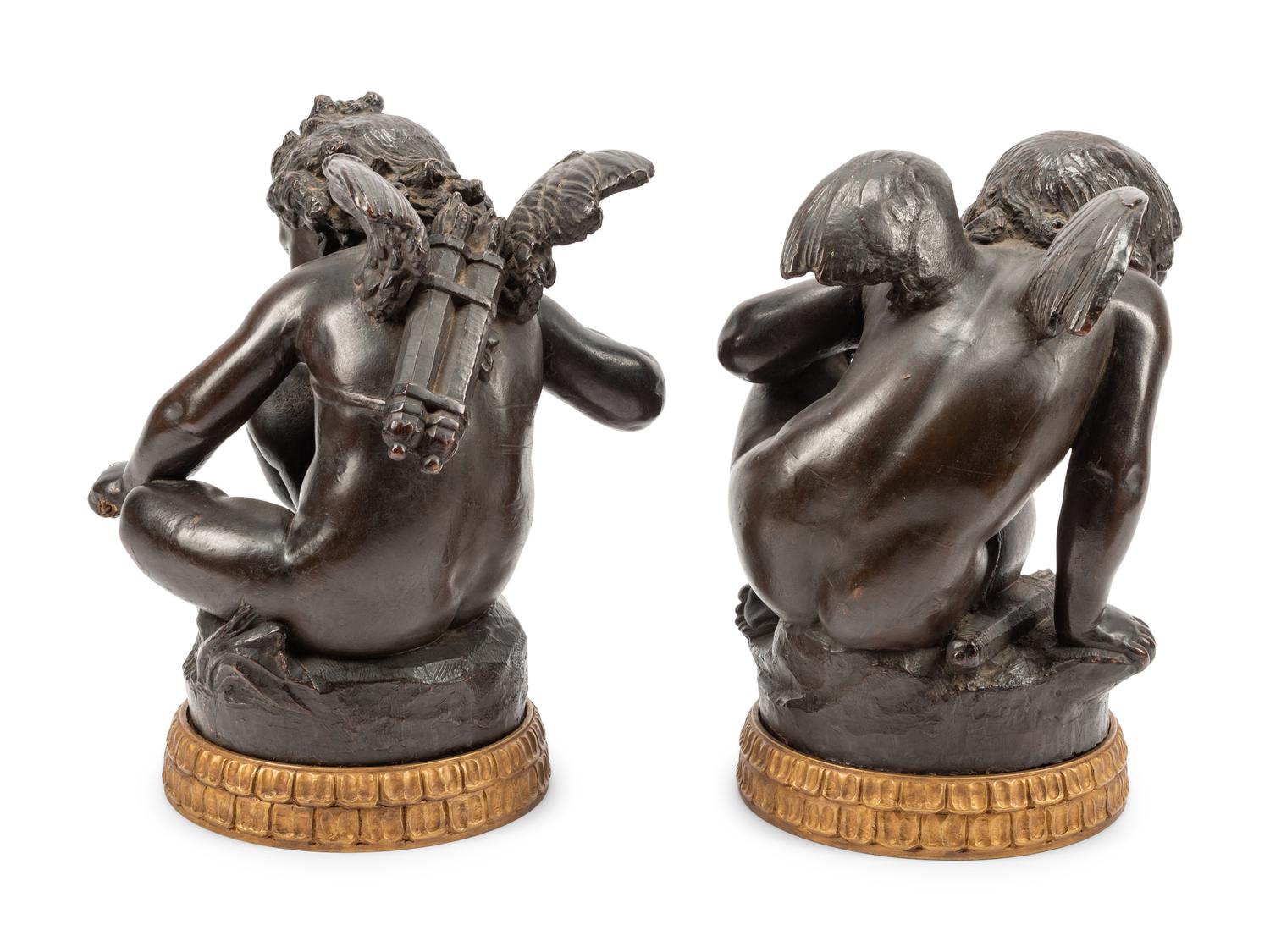 A Pair of Bronzed Terra Cotta Figures on Giltwood Bases