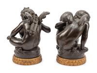 A Pair of Bronzed Terra Cotta Figures on Giltwood Bases