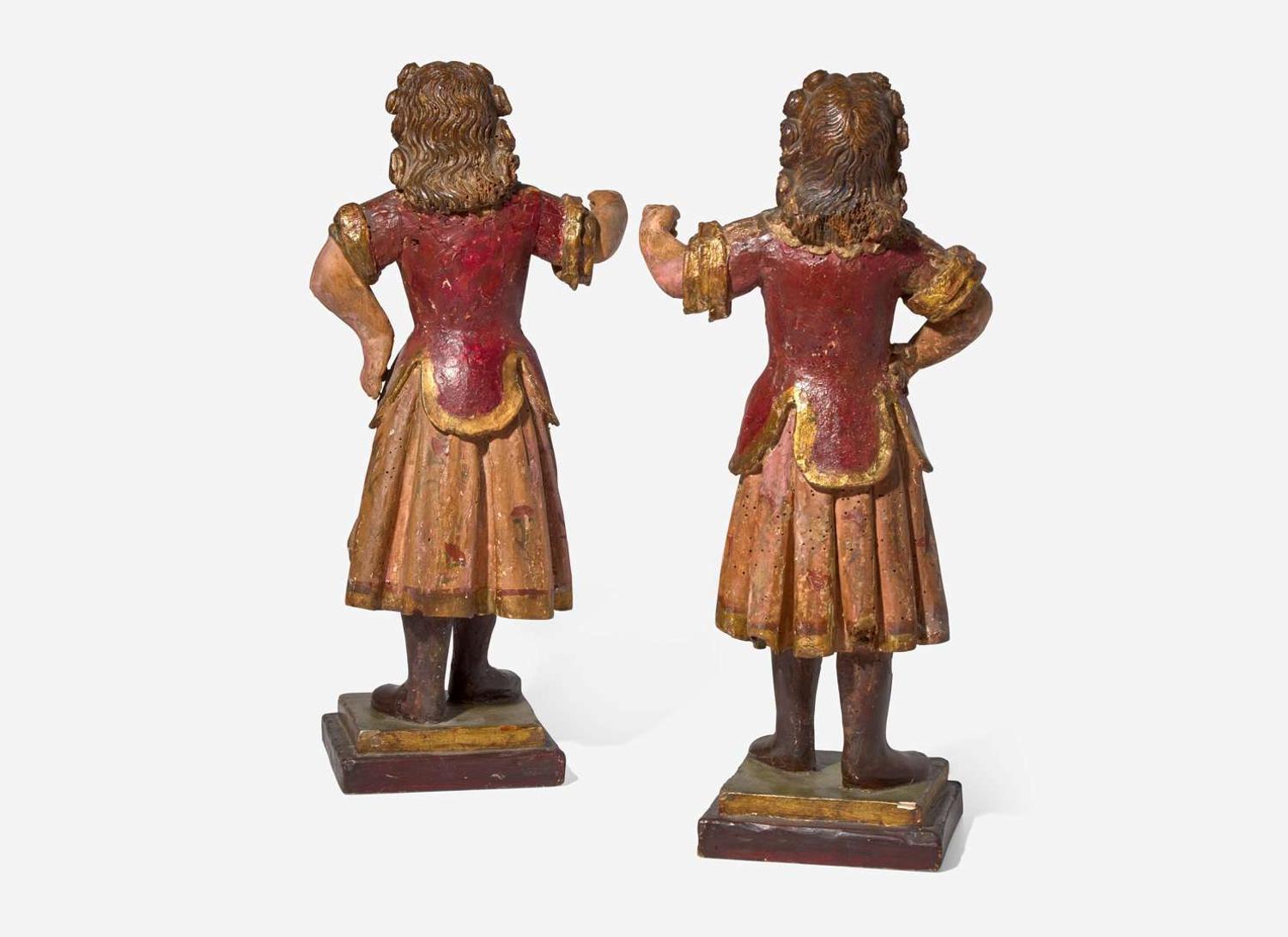 A small pair of Italian carved and polychromed wood figures, 18th century
