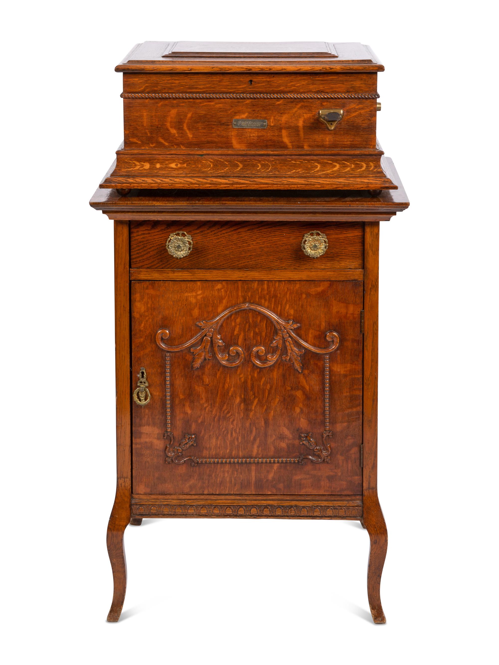 A Regina Coin Operated 15 1/2 Inch Disc Music Box and Stand