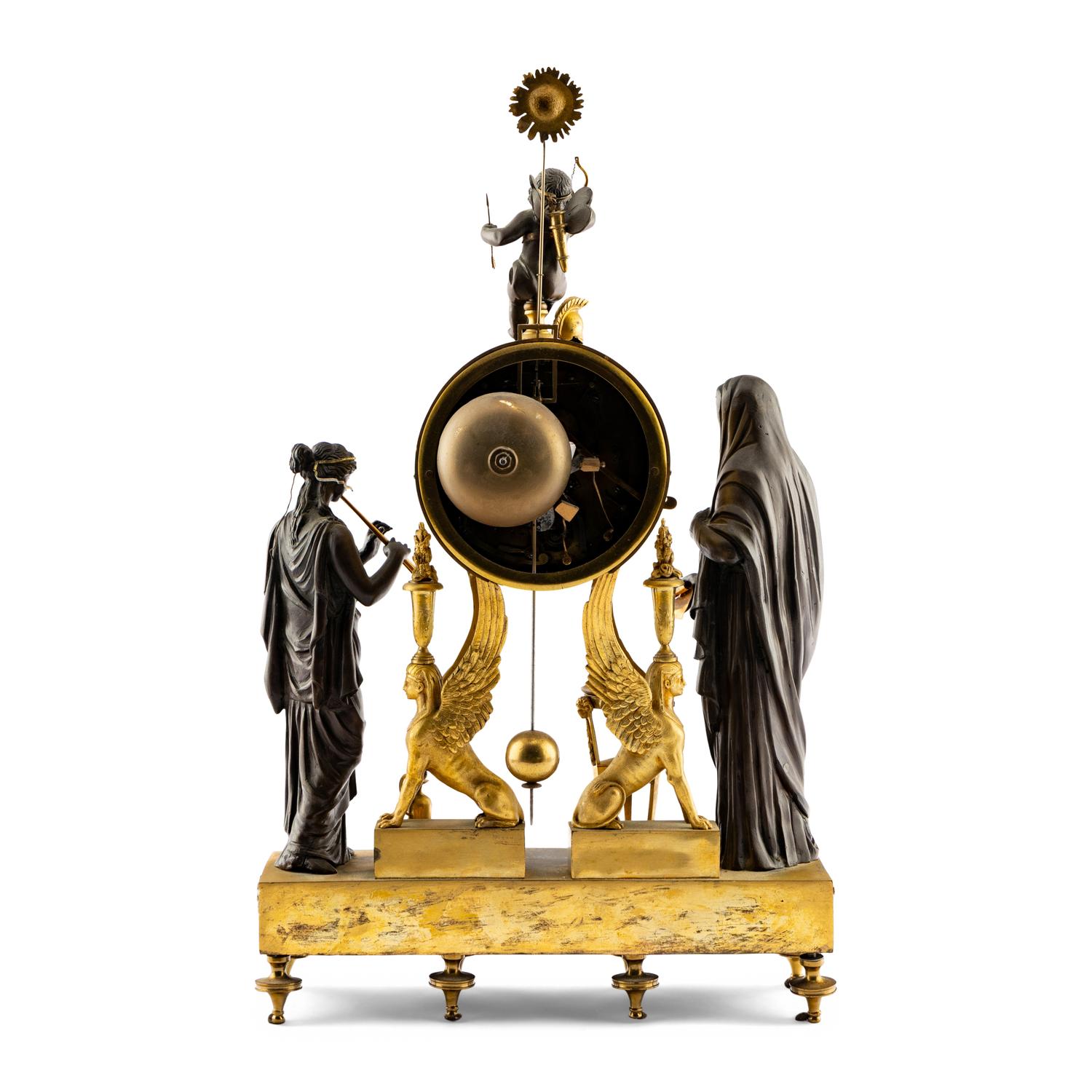 An Empire Style Gilt and Patinated Bronze Mantel Clock