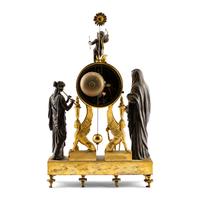 An Empire Style Gilt and Patinated Bronze Mantel Clock