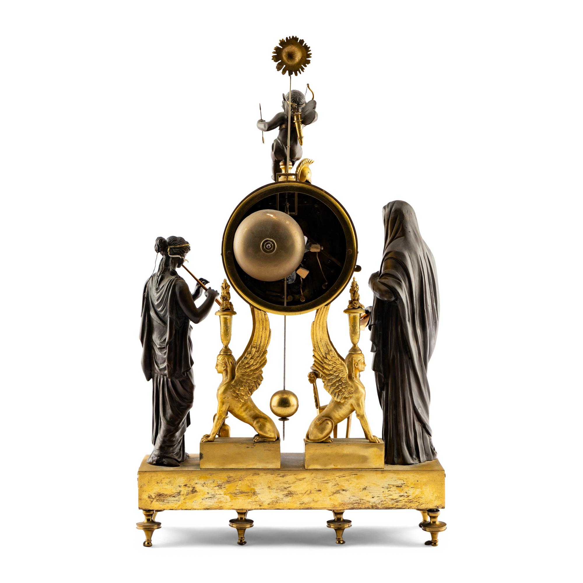 An Empire Style Gilt and Patinated Bronze Mantel Clock