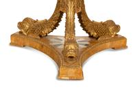 An Italian Design Pietra Dura Center Table with Carved Giltwood Dolphin Base