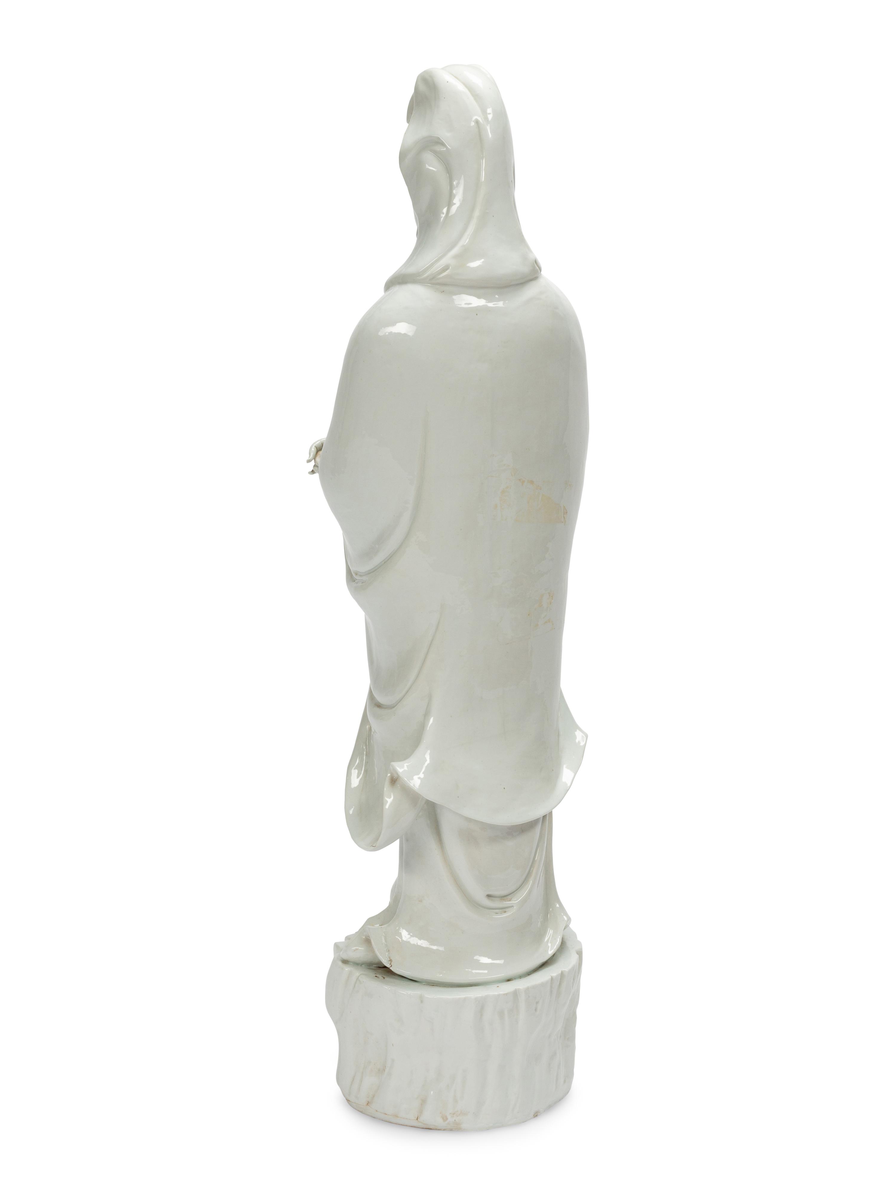 A Large Chinese Export White Glazed Porcelain Figure of Guanyin