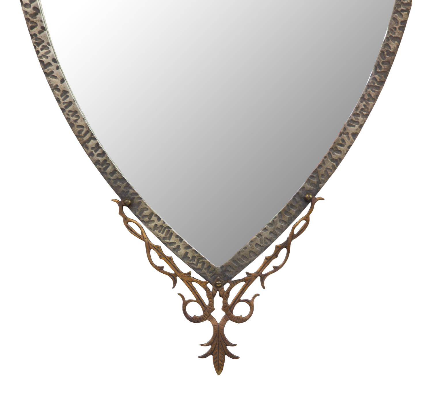 A Continental Brass and Iron Shield-form Mirror