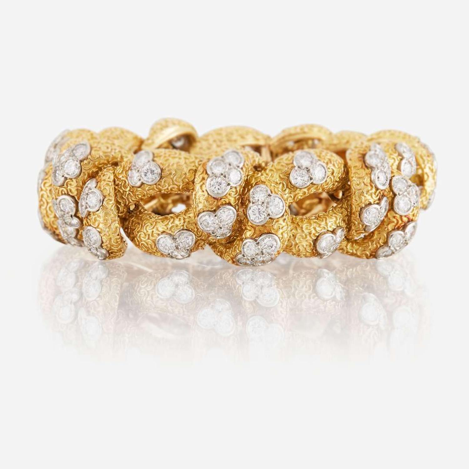 A gold, diamond, and platinum bracelet