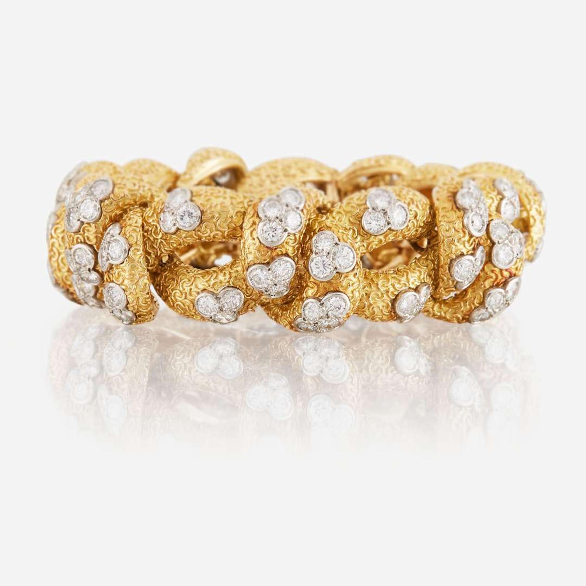A gold, diamond, and platinum bracelet