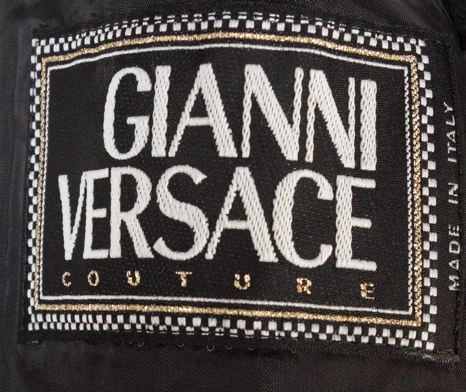 A Gianni Versace Black Bondage Jacket, Size 42.