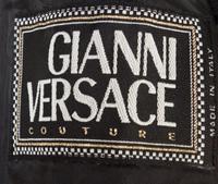 A Gianni Versace Black Bondage Jacket, Size 42.