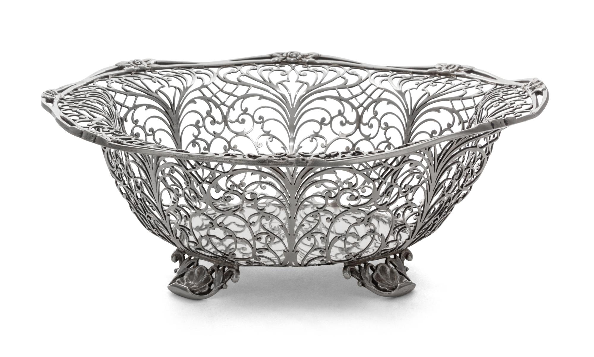 An American Silver Basket, Howard & Co., New York, NY, having a scrolling foliate open bowl with an octagonal bottom, raised on four sh