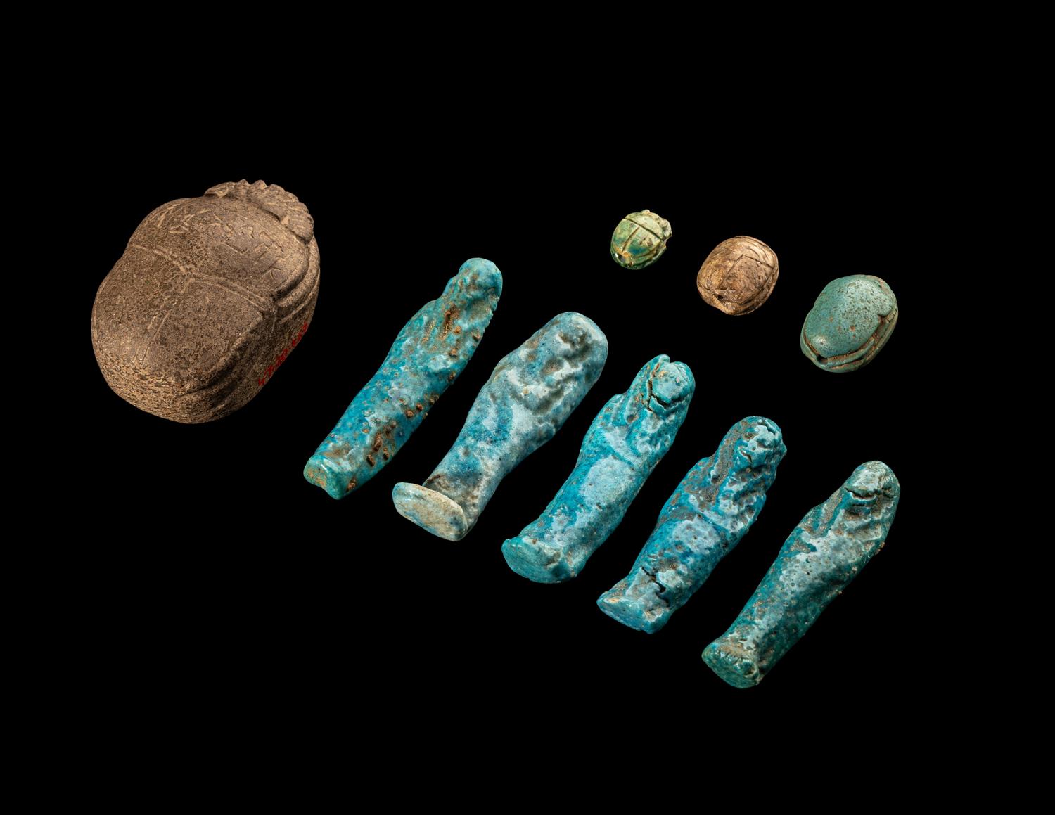Five Egyptian Faience Ushabtis and Four Egyptian Faience and Stone Scarabs