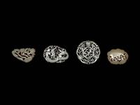 Four Chinese Celadon Jade Reticulated Carvings