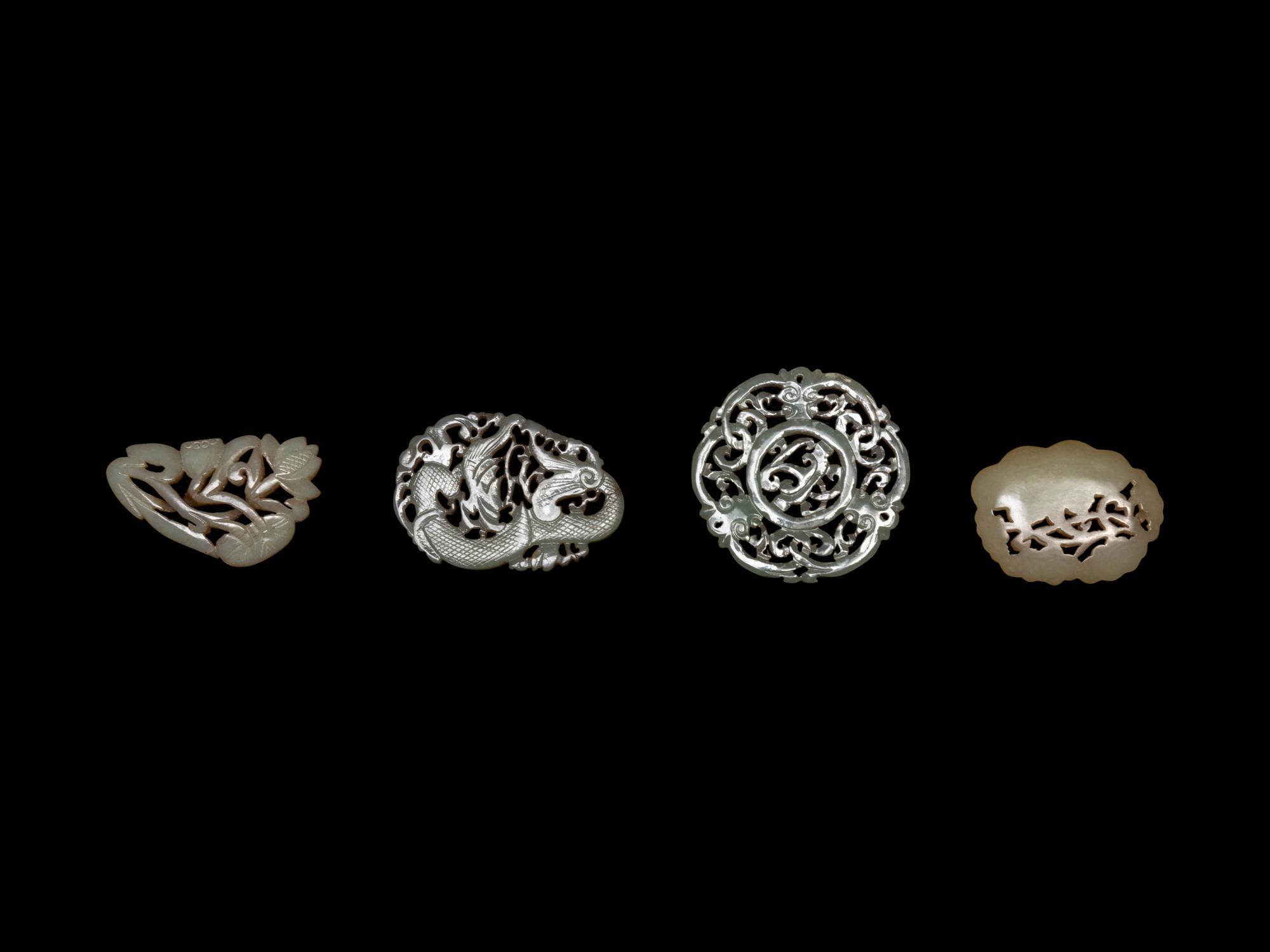 Four Chinese Celadon Jade Reticulated Carvings