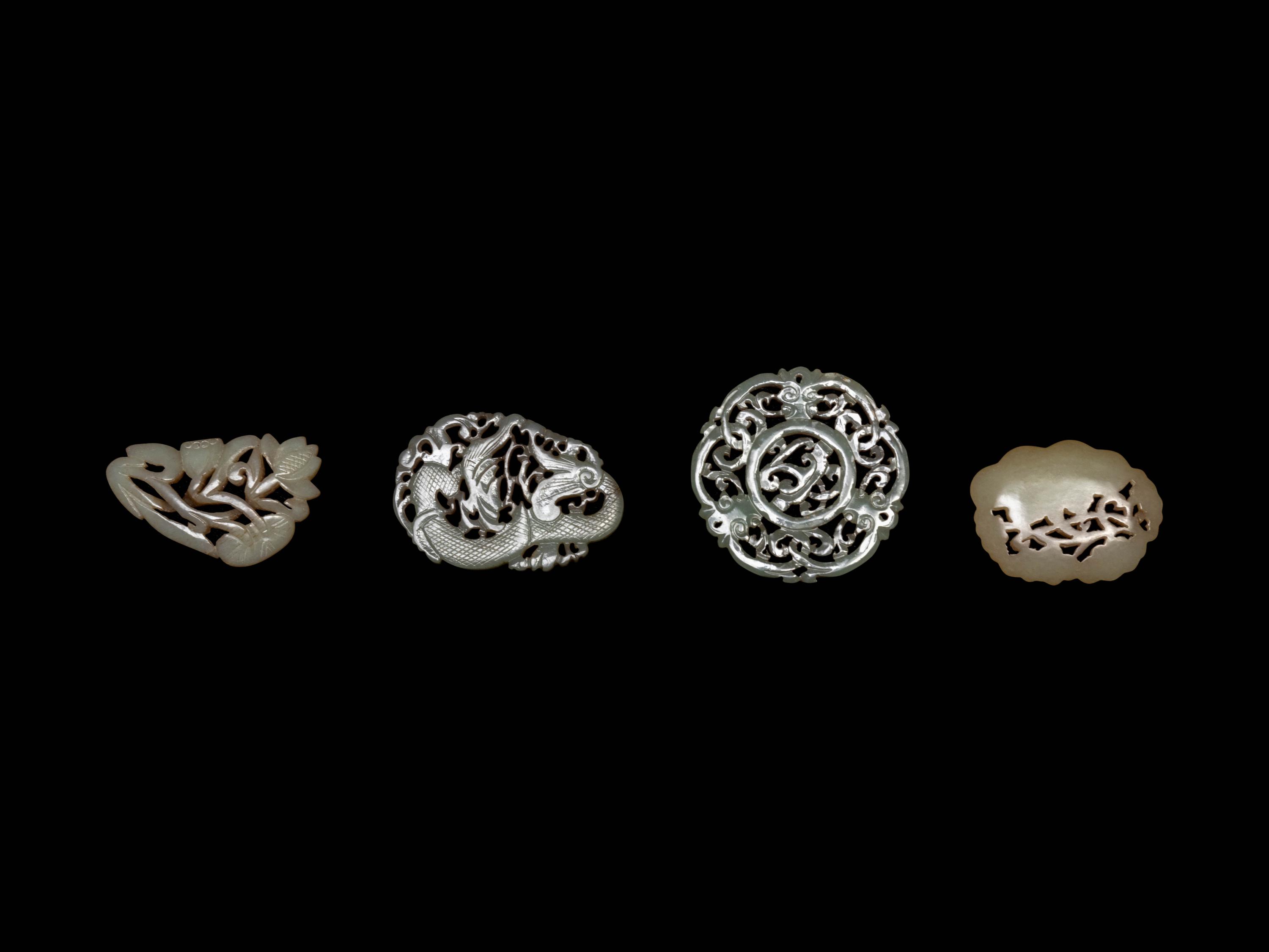 Four Chinese Celadon Jade Reticulated Carvings