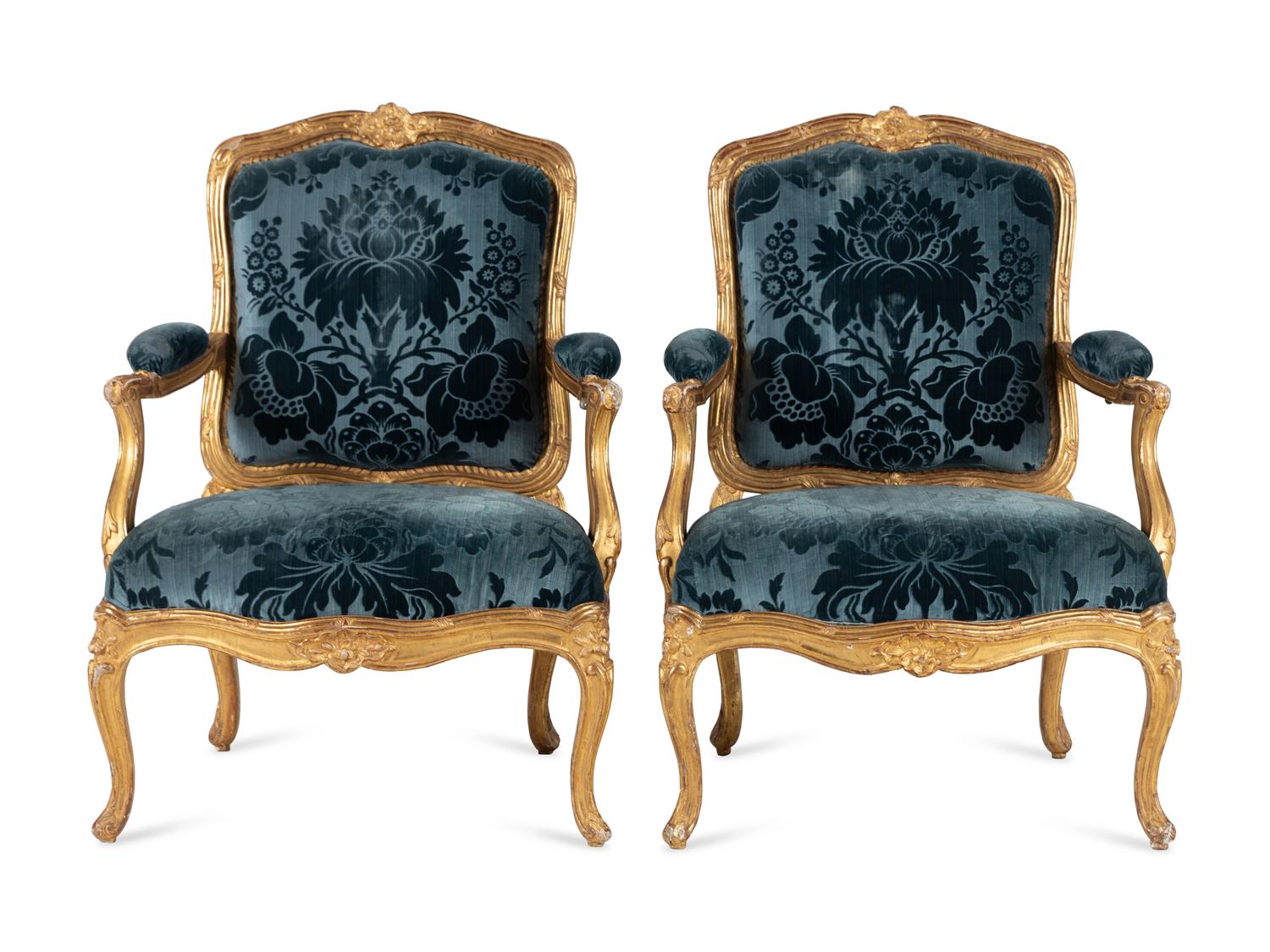 A Pair of Louis XV Carved Giltwood Fauteuils à la Reine