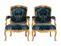 A Pair of Louis XV Carved Giltwood Fauteuils à la Reine