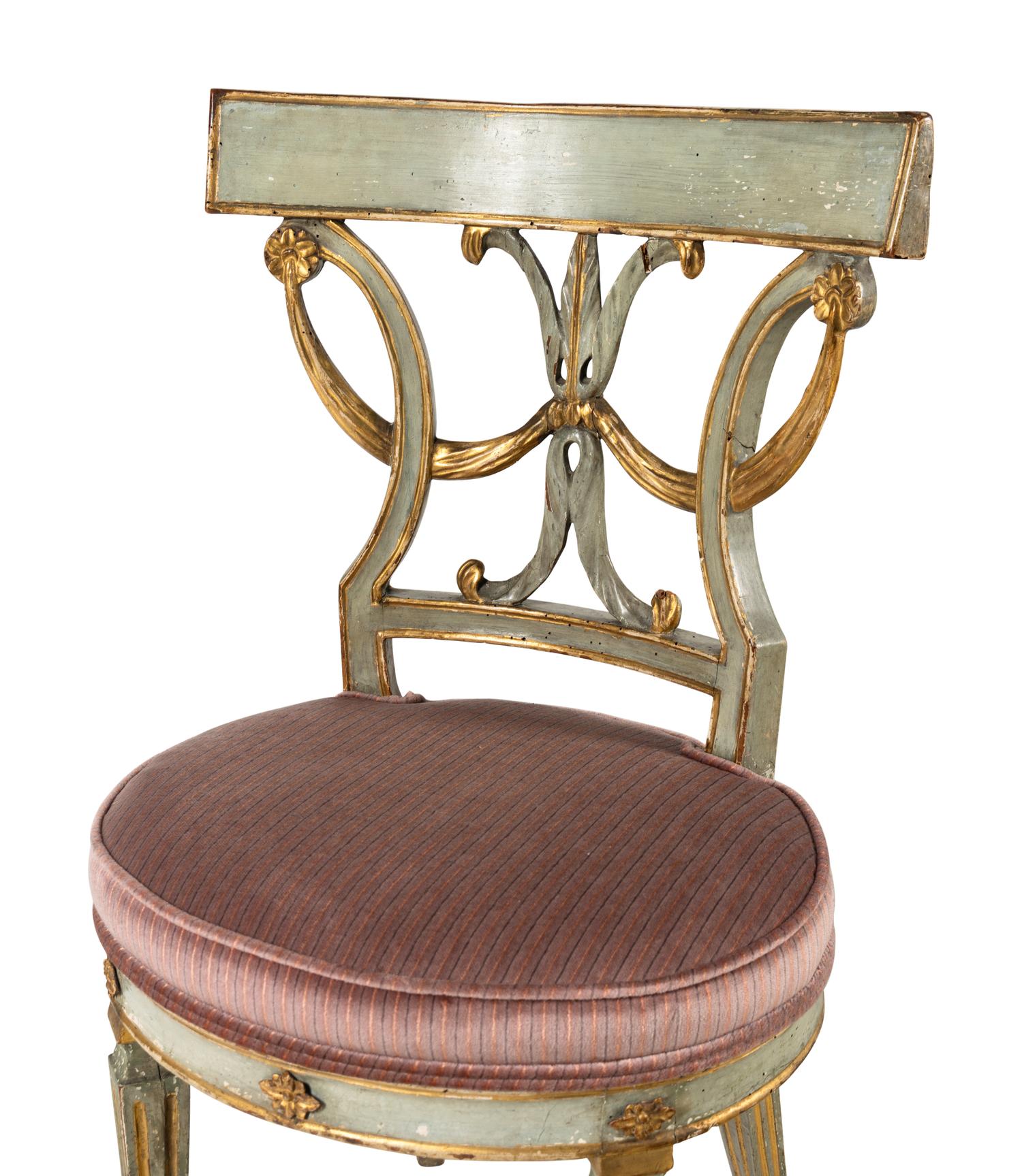 A Pair of Italian Neoclassical Blue Painted and Parcel Gilt Side Chairs