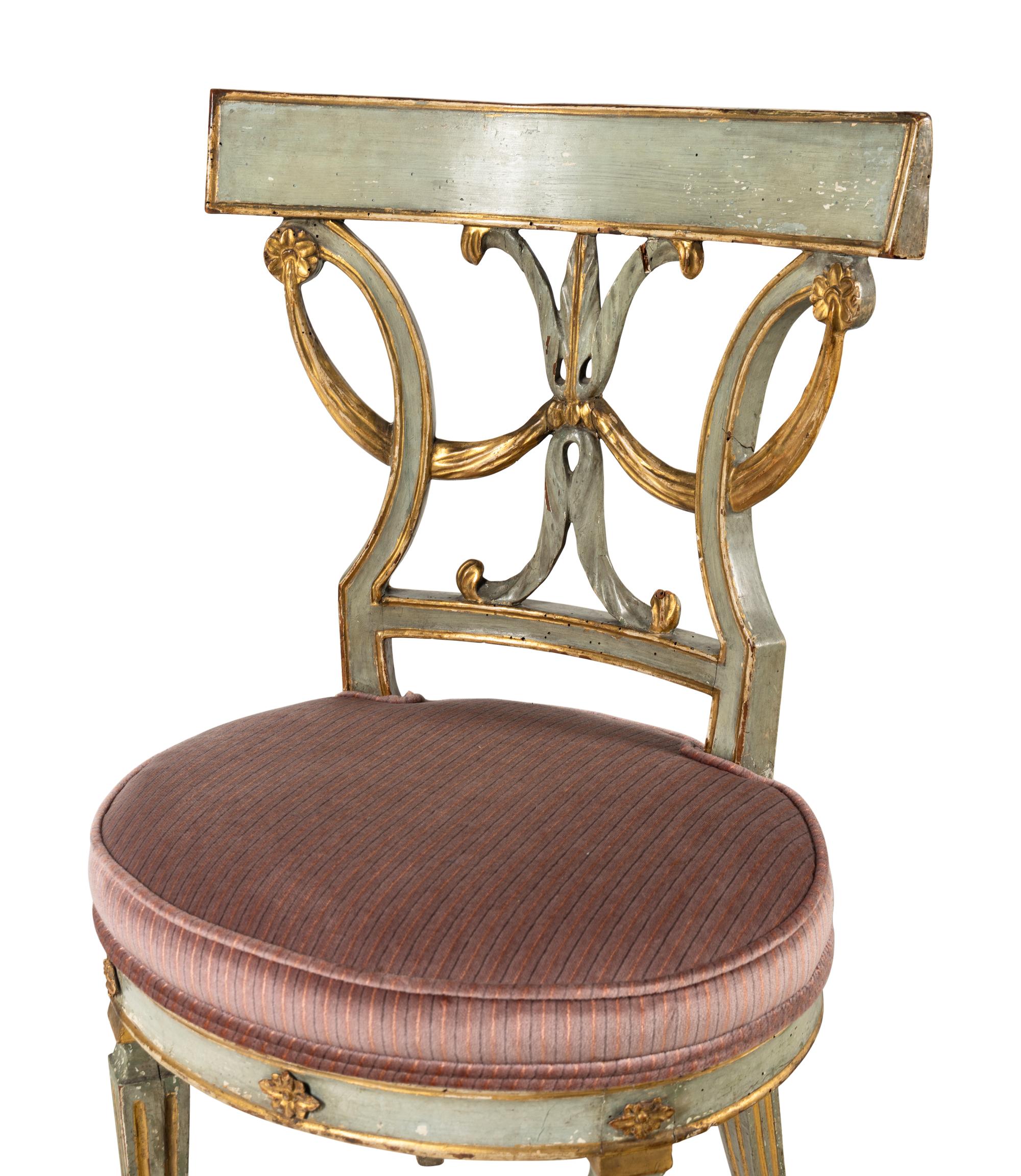A Pair of Italian Neoclassical Blue Painted and Parcel Gilt Side Chairs