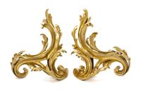 A Pair of Louis XV Style Gilt Bronze Chenets, Height of each 18 1/2 x width 15 1/2 inches.