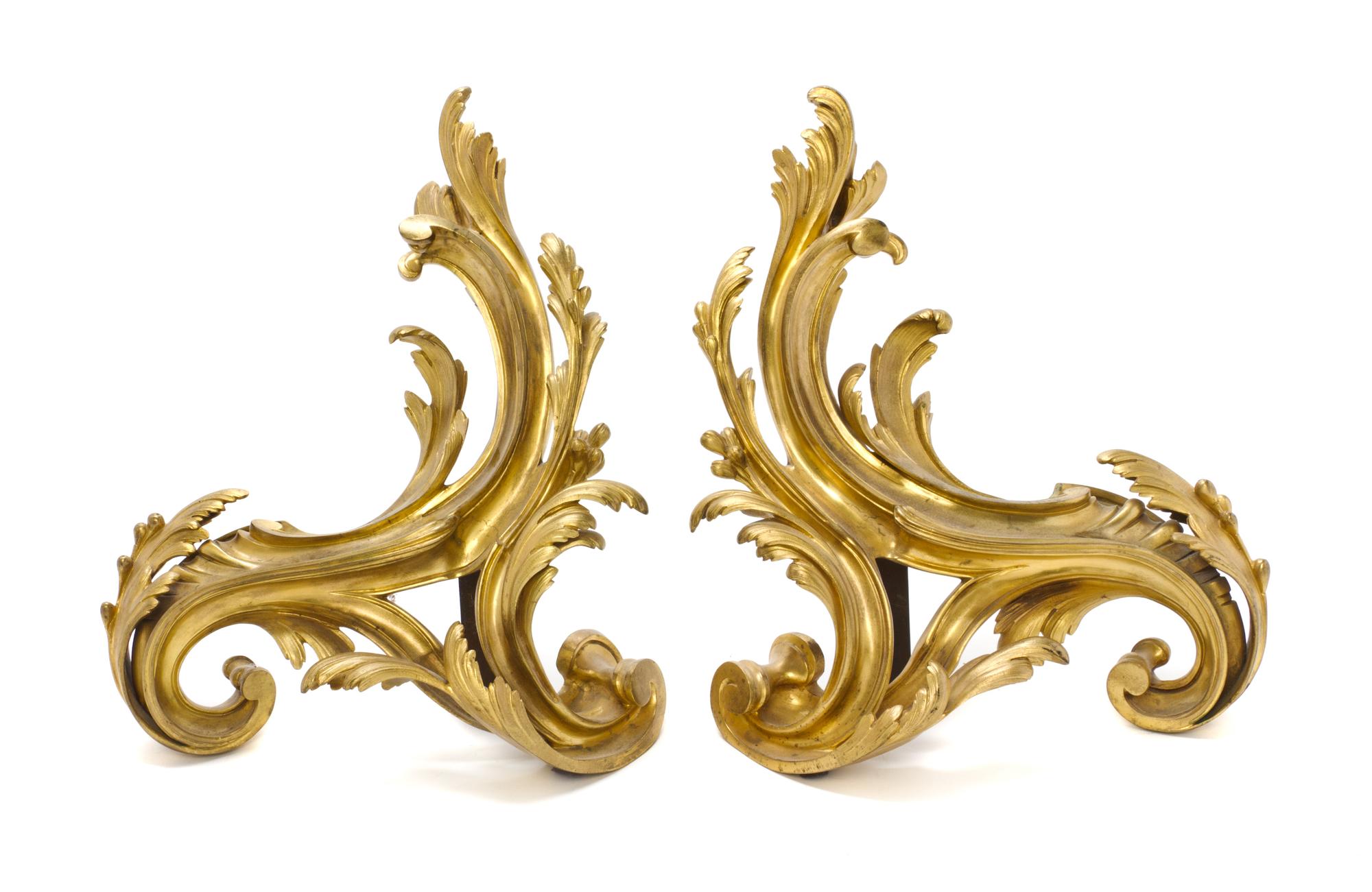 A Pair of Louis XV Style Gilt Bronze Chenets, Height of each 18 1/2 x width 15 1/2 inches.