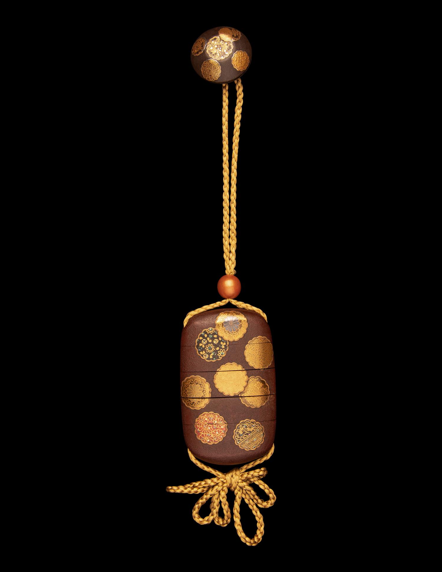 A Japanese Simulated Leather and Lacquered Four-Case Inro