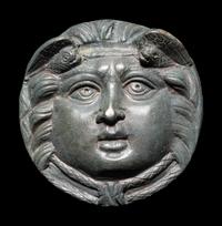 A Roman Bronze Roundel with Head of a Gorgon