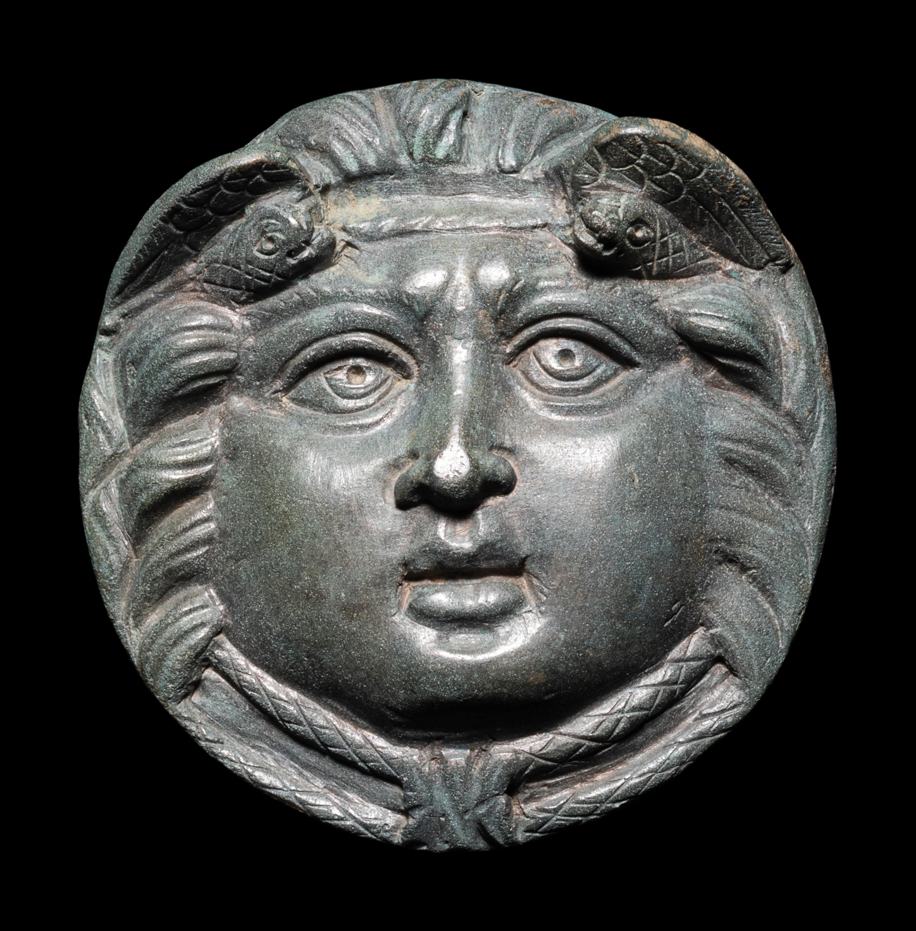 A Roman Bronze Roundel with Head of a Gorgon