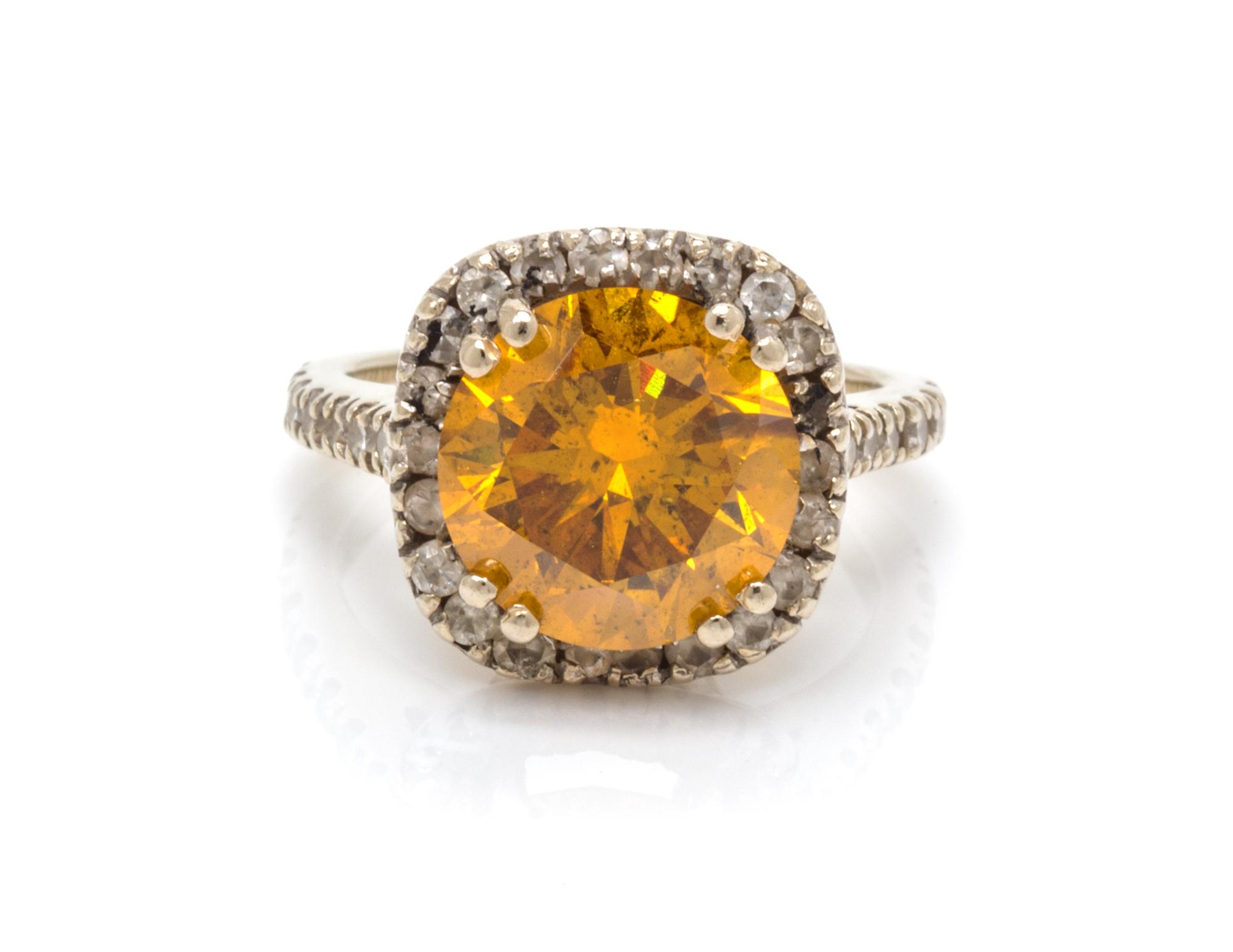 A White Gold, Colored Diamond and Diamond Ring, 3.20 dwts.