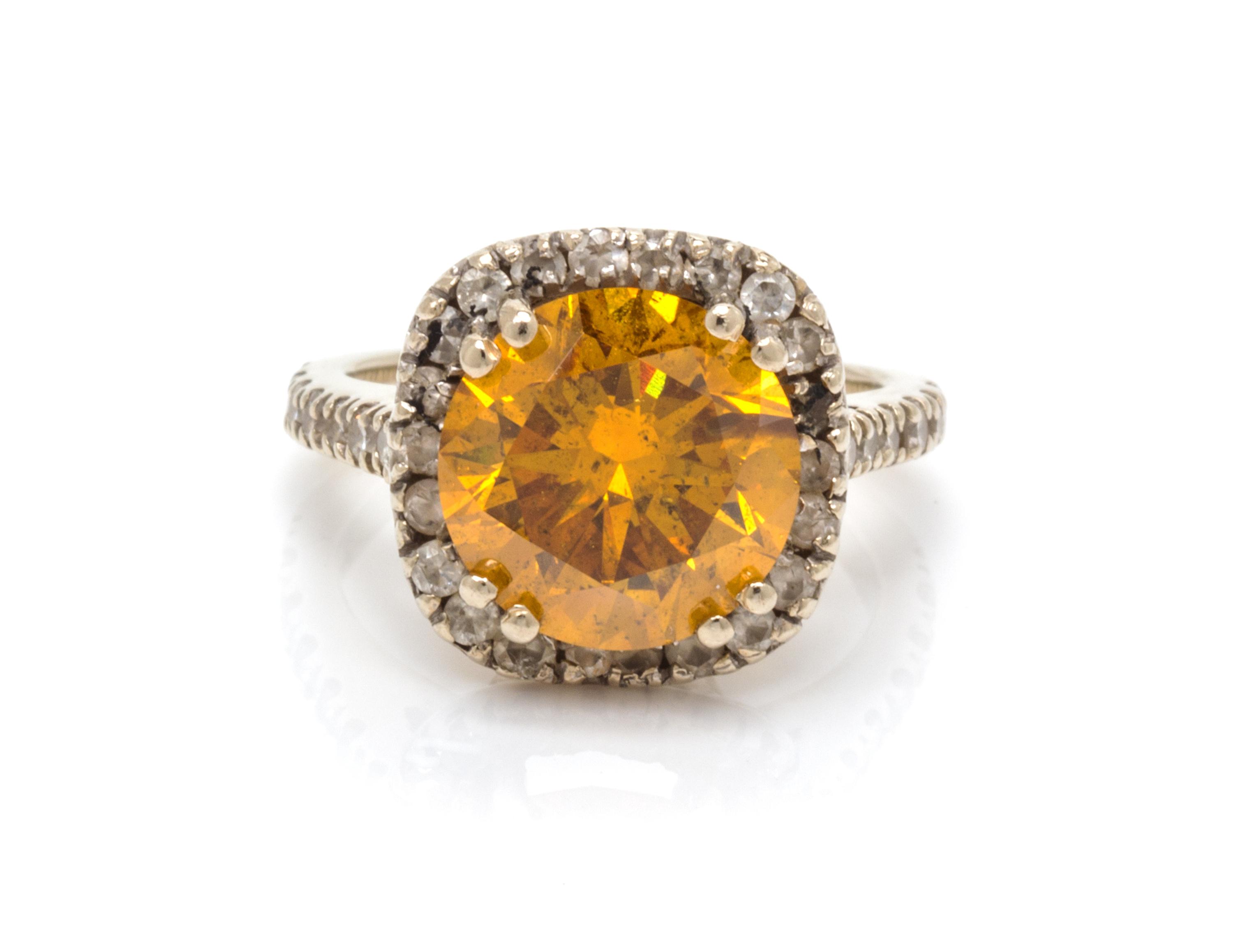 A White Gold, Colored Diamond and Diamond Ring, 3.20 dwts.